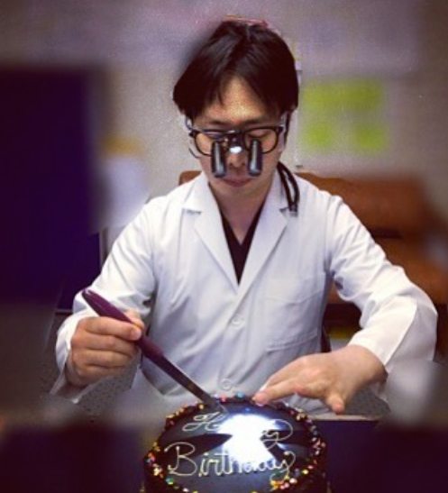 Dr. Katafuchi operating on a birthday cake