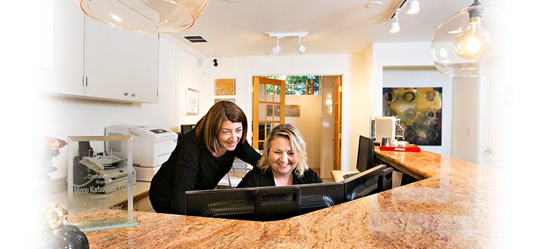 Dr. Karbakhsch and Staff Member at MK Perio Front Desk